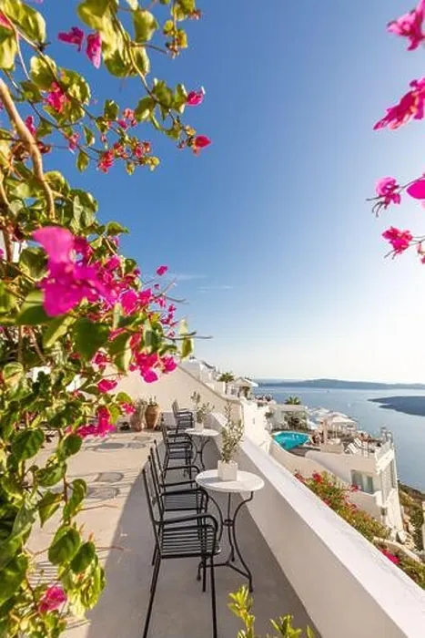 Framed Print : White architecture on Santorini island, Greece. Beautiful landscape with sea view. Chairs with flowers, romantic terrace sea view. Luxury travel Framed Print : White architecture on Santorini island, Greece. Beautiful landscape with sea view. Chairs with flowers, romantic terrace sea view. Luxury travel