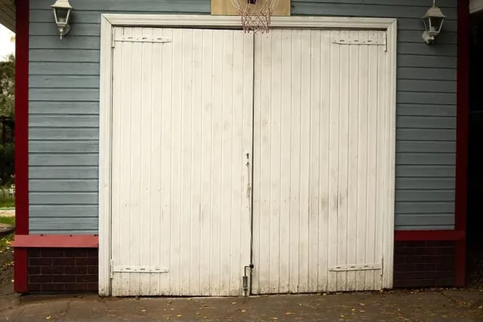 Framed Print : White garage door. Entrance to the house Framed Print : White garage door. Entrance to the house