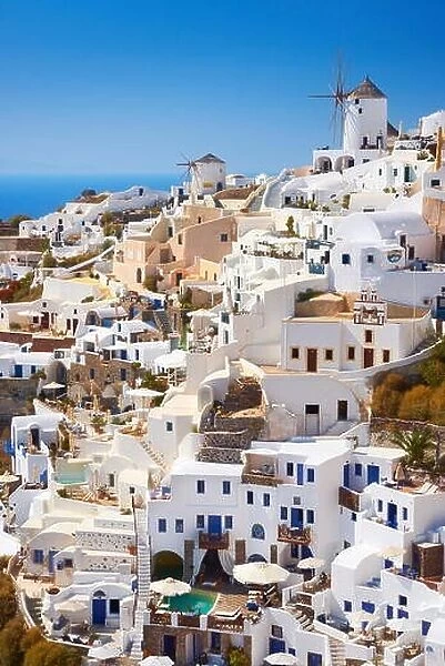 White houses and windmiil in Oia Town, Santorini Island, Cyclades, Greece