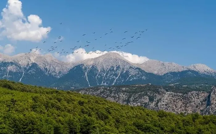 Framed Print : The White Mountains (Ak daglar) with birds in a blue sky background. Antalya, Turkey