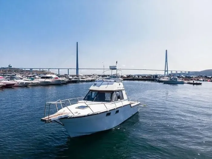 Framed Print : A white pleasure boat stands in the bay at sea, in the parking lot. Yacht background of other boats. Photo from a drone Framed Print : A white pleasure boat stands in the bay at sea, in the parking lot. Yacht background of other boats. Photo from a drone