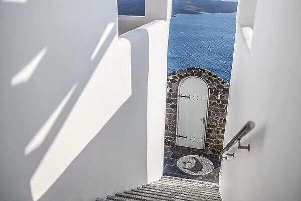 White stairs of the traditional white Greek architecture apartment with a great view on sea, Santorini island, Greece. Summer travel background
