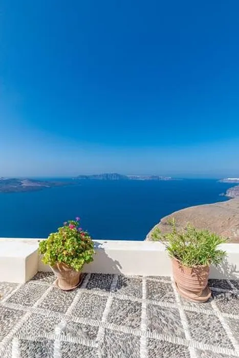 Framed Print : White wash architecture on Santorini Island, Greece. The view toward Caldera sea with relaxing summer travel vacation mood, vibes. Romance love couple Framed Print : White wash architecture on Santorini Island, Greece. The view toward Caldera sea with relaxing summer travel vacation mood, vibes. Romance love couple