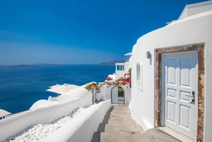 Framed Print : White wash staircases and entrance on Santorini Island, Greece. The view toward Caldera sea view. Famous tourism attraction, destination scenic Framed Print : White wash staircases and entrance on Santorini Island, Greece. The view toward Caldera sea view. Famous tourism attraction, destination scenic