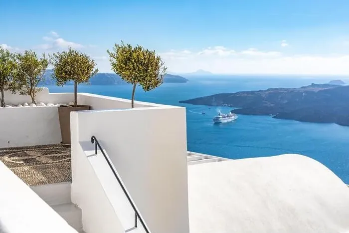 Framed Print : White wash staircases on Santorini Island, Greece. The view toward Caldera sea with cruise ship awaiting. Luxury summer travel, dream vacation Framed Print : White wash staircases on Santorini Island, Greece. The view toward Caldera sea with cruise ship awaiting. Luxury summer travel, dream vacation
