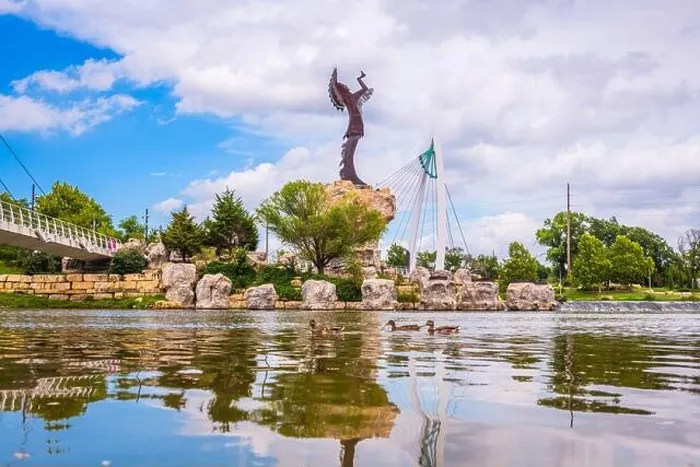 Framed Print : WICHITA, KANSAS - AUGUS 30, 2018: The confluence of the Arkansas and Little Arkansas River at the Keeper of the Plains near downtown Wichita Framed Print : WICHITA, KANSAS - AUGUS 30, 2018: The confluence of the Arkansas and Little Arkansas River at the Keeper of the Plains near downtown Wichita