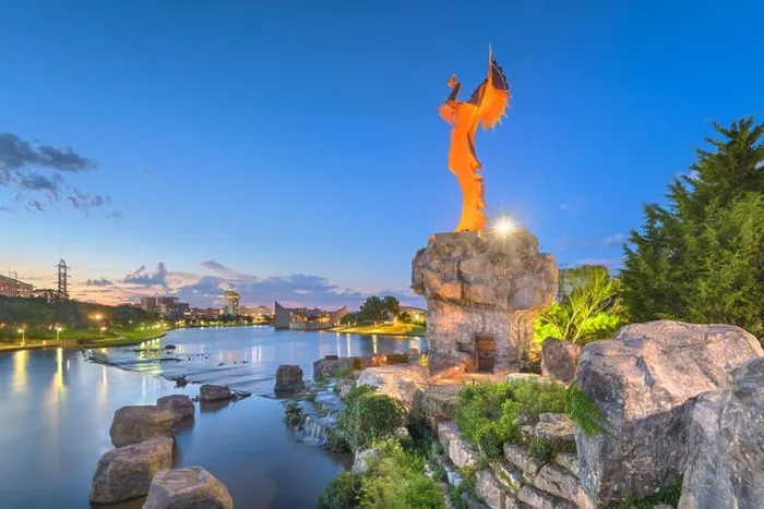 Framed Print : WICHITA, KANSAS - AUGUS 31, 2018: The confluence of the Arkansas and Little Arkansas River at the Keeper of the Plains near downtown Wichita at dawn Framed Print : WICHITA, KANSAS - AUGUS 31, 2018: The confluence of the Arkansas and Little Arkansas River at the Keeper of the Plains near downtown Wichita at dawn