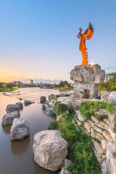Framed Print : WICHITA, KANSAS - AUGUS 31, 2018: The confluence of the Arkansas and Little Arkansas River at the Keeper of the Plains near downtown Wichita at dawn Framed Print : WICHITA, KANSAS - AUGUS 31, 2018: The confluence of the Arkansas and Little Arkansas River at the Keeper of the Plains near downtown Wichita at dawn