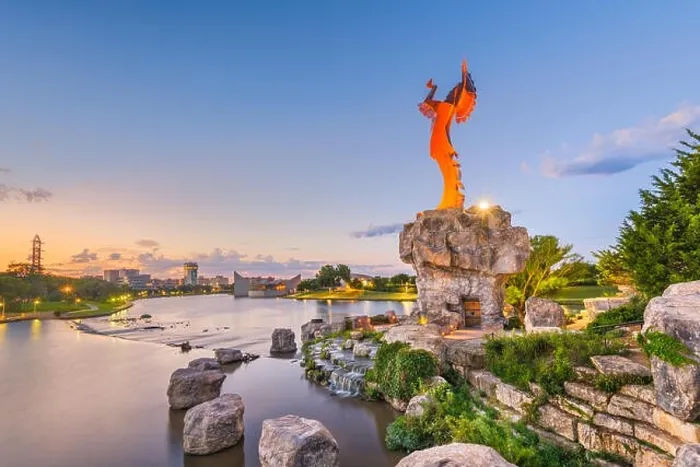 Framed Print : WICHITA, KANSAS - AUGUS 31, 2018: The confluence of the Arkansas and Little Arkansas River at the Keeper of the Plains near downtown Wichita at dawn Framed Print : WICHITA, KANSAS - AUGUS 31, 2018: The confluence of the Arkansas and Little Arkansas River at the Keeper of the Plains near downtown Wichita at dawn