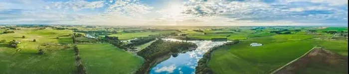 Framed Print : Wide aerial panorama of river flowing through grasslands, meadows, and pastures in Australia at sunset Framed Print : Wide aerial panorama of river flowing through grasslands, meadows, and pastures in Australia at sunset