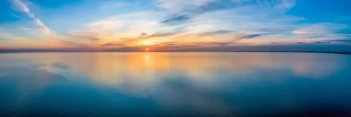 Framed Print : Wide aerial panorama of seascape - sunset reflecting in calm sea Framed Print : Wide aerial panorama of seascape - sunset reflecting in calm sea