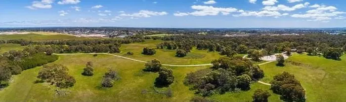 Framed Print : Wide aerial panoramic landscape of path winding through park with green grass and trees Framed Print : Wide aerial panoramic landscape of path winding through park with green grass and trees