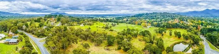 Framed Print : Wide aerial panoramic landscape of scenic countryside. Grasslands among trees and mountains in Australia Framed Print : Wide aerial panoramic landscape of scenic countryside. Grasslands among trees and mountains in Australia