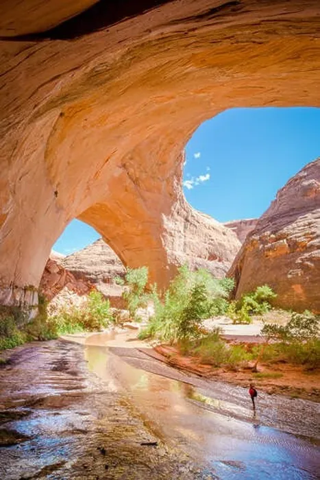 Framed Print : Wide angle view of a hiker backpacking beneath stunning Jacob Hamblin Arch in Coyote Gulch Framed Print : Wide angle view of a hiker backpacking beneath stunning Jacob Hamblin Arch in Coyote Gulch