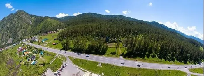Framed Print : A wide banner aerial view of the direct road with cars in the Altai mountains surrounded by green forest and trees Framed Print : A wide banner aerial view of the direct road with cars in the Altai mountains surrounded by green forest and trees