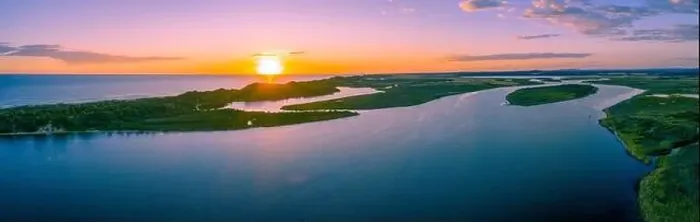 Framed Print : Wide minimalist aerial panorama of sunset over ocean coastline Framed Print : Wide minimalist aerial panorama of sunset over ocean coastline