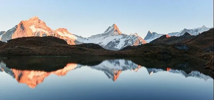 Framed Print : Wide panorama of Bachalpsee lake in Swiss Alps mountains. Snowy peaks of Wetterhorn, Mittelhorn and Rosenhorn on background Framed Print : Wide panorama of Bachalpsee lake in Swiss Alps mountains. Snowy peaks of Wetterhorn, Mittelhorn and Rosenhorn on background