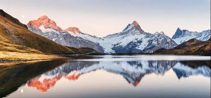 Framed Print : Wide panorama of Bachalpsee lake in Swiss Alps mountains. Snowy peaks of Wetterhorn, Mittelhorn and Rosenhorn on background Framed Print : Wide panorama of Bachalpsee lake in Swiss Alps mountains. Snowy peaks of Wetterhorn, Mittelhorn and Rosenhorn on background