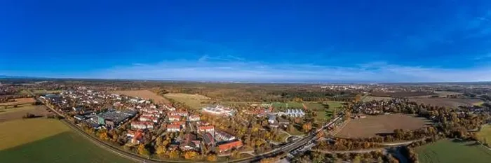 Framed Print : Wide view over the bavarian city Oberhaching in colors of the indian summer as panoramic aerial photo Framed Print : Wide view over the bavarian city Oberhaching in colors of the indian summer as panoramic aerial photo