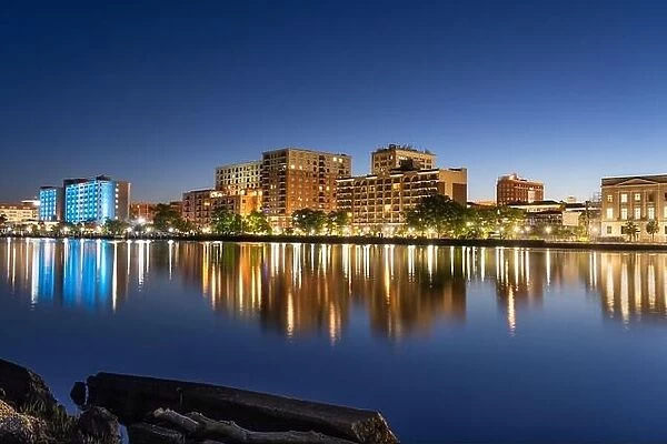 Wilmington, North Carolina, USA downtown city skyline on the Cape Fear River at night