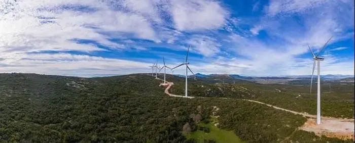 Framed Print : Wind farm panorama. Wind turbines and curvy road on the hill Framed Print : Wind farm panorama. Wind turbines and curvy road on the hill