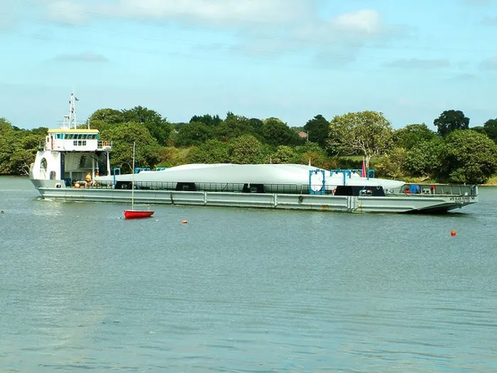 Framed Print : WInd farm turbine blades being transported by river Framed Print : WInd farm turbine blades being transported by river