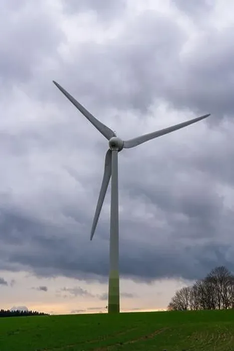 Framed Print : Windmill against a gray sky stands in field. Rural landscape. Wind turbine. Sources of energy Framed Print : Windmill against a gray sky stands in field. Rural landscape. Wind turbine. Sources of energy
