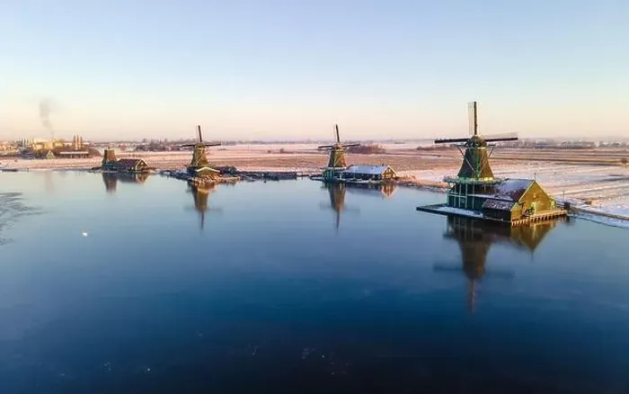 Framed Print : Windmill village during winter with snow in the Netherlands Holland Zaanse Schans village in winter