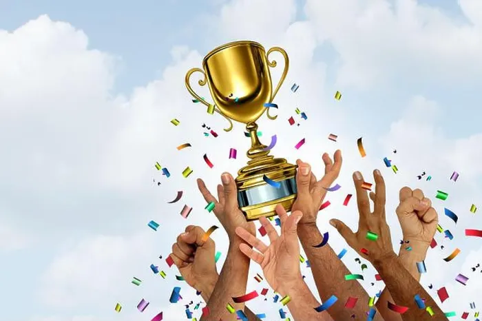 Framed Print : Winning team and winner symbol as a Gold cup winner or trophy for teamwork success concept as a victory for first Framed Print : Winning team and winner symbol as a Gold cup winner or trophy for teamwork success concept as a victory for first