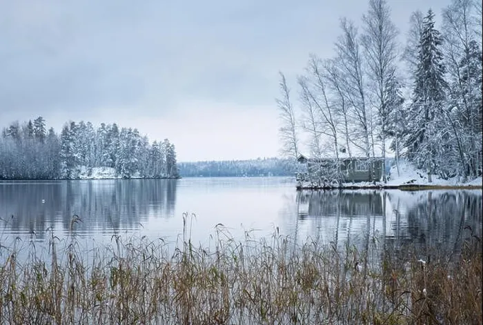 Framed Print : Winter landscape with sauna cottage and peaceful lake at evening in Finland Framed Print : Winter landscape with sauna cottage and peaceful lake at evening in Finland