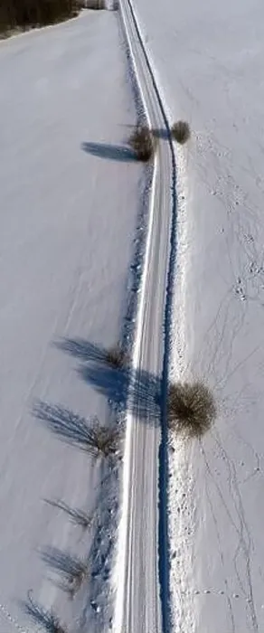 Framed Print : Winter rural gravel road in snow, vertical pano, aerial view Framed Print : Winter rural gravel road in snow, vertical pano, aerial view
