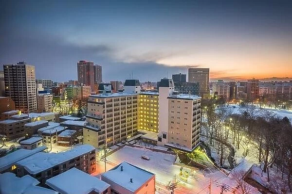 Wintery city skyline in Sapporo, Japan over looking Nakajima Park at dawn