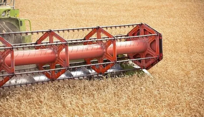 Framed Print : Witness the Harvest: A Stunning Drone Shot of a Wheat-Collecting Combine in Action