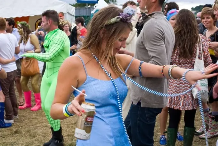Framed Print : A woman with a can of beer and a cigarette dances in a field to a mobile sound system at the Standon Calling Festival Framed Print : A woman with a can of beer and a cigarette dances in a field to a mobile sound system at the Standon Calling Festival
