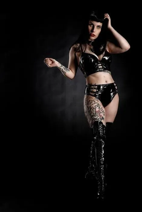 Framed Print : Woman with black hair and tattos in vinyl and latex outfit, BDSM Framed Print : Woman with black hair and tattos in vinyl and latex outfit, BDSM