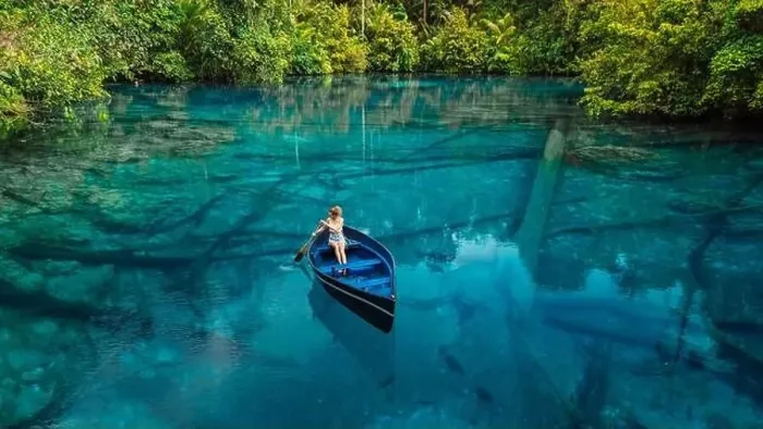 Framed Print : Woman on boat floating in tropical transparent lake with crystal blue fresh water in Sulawesi, Indonesia. Aerial view Framed Print : Woman on boat floating in tropical transparent lake with crystal blue fresh water in Sulawesi, Indonesia. Aerial view