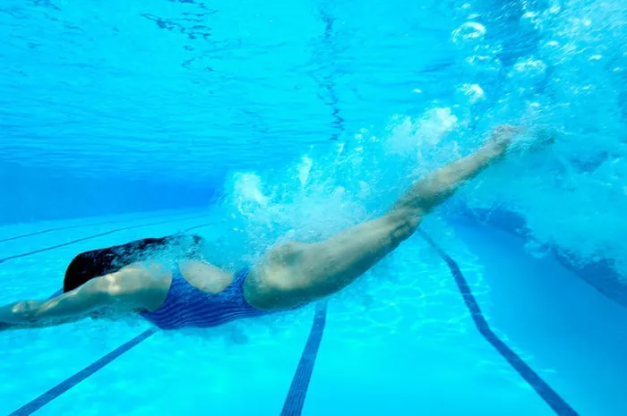 Framed Print : Woman diving in swimming pool, underwater view Framed Print : Woman diving in swimming pool, underwater view