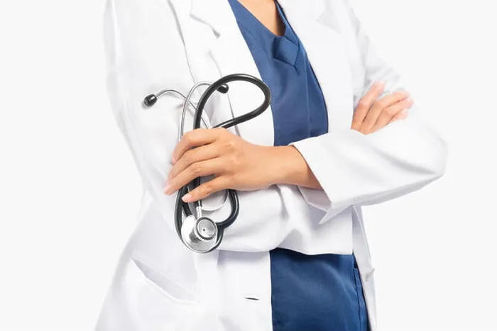 Framed Print : Woman doctor in white lab coat holding stethoscope on her hands isolated over white background Framed Print : Woman doctor in white lab coat holding stethoscope on her hands isolated over white background