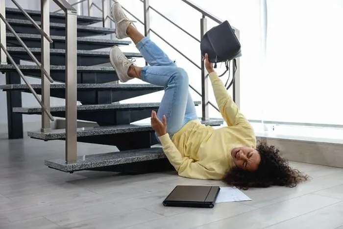 Framed Print : Woman falling on stairs in building. Dangerous accident Framed Print : Woman falling on stairs in building. Dangerous accident
