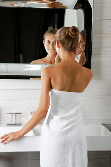 Framed Print : Woman getting ready in bathroom Framed Print : Woman getting ready in bathroom