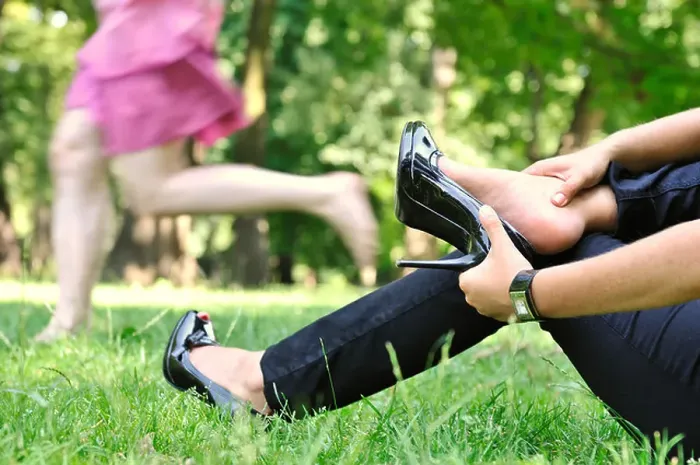 Framed Print : One woman running barefoot in park and second is taking her shoes off Framed Print : One woman running barefoot in park and second is taking her shoes off