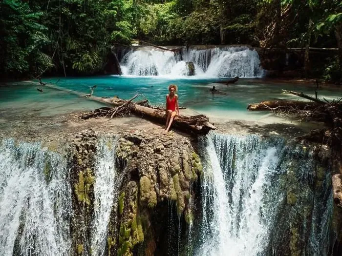 Framed Print : Woman on scenic cascade waterfall in Central Sulawesi, drone view Framed Print : Woman on scenic cascade waterfall in Central Sulawesi, drone view