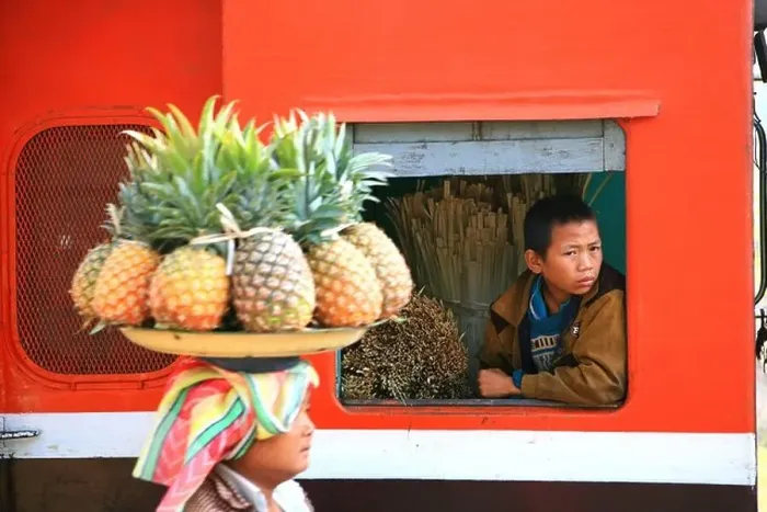 Framed Print : A woman selling fruit, a boy looking out of the window of a train, Hispaw, Shan State, Myanmar, Burma, Asia Framed Print : A woman selling fruit, a boy looking out of the window of a train, Hispaw, Shan State, Myanmar, Burma, Asia