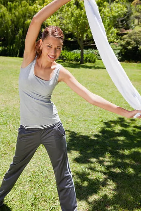 Framed Print : Woman stretching with her towel Framed Print : Woman stretching with her towel