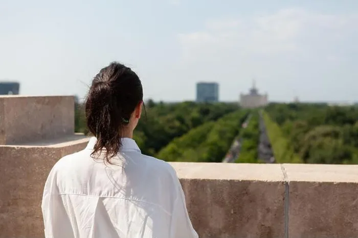 Framed Print : Woman toursit standing on building rooftop enjoying seeing panoramic view of metropolitan city during summer vacantion Framed Print : Woman toursit standing on building rooftop enjoying seeing panoramic view of metropolitan city during summer vacantion