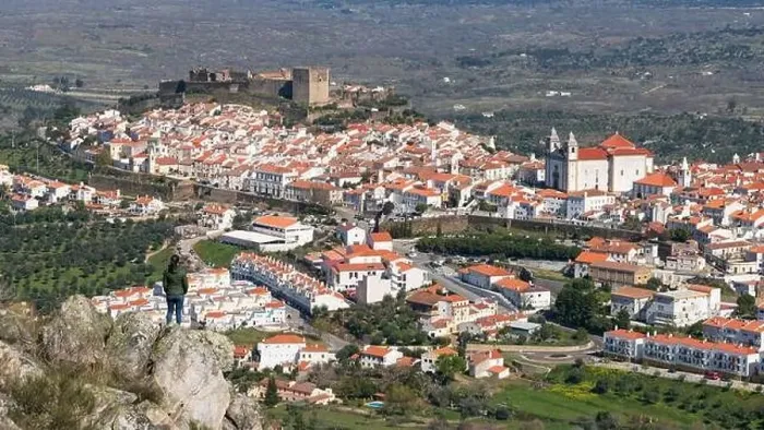 Framed Print : Woman viewing Castelo de Vide from a rock in Alentejo, Portugal from Serra de Sao Mamede mountains Framed Print : Woman viewing Castelo de Vide from a rock in Alentejo, Portugal from Serra de Sao Mamede mountains
