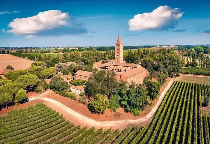 Framed Print : Wonderful summer view of Pomposa Abbey tower among the green vineyards Framed Print : Wonderful summer view of Pomposa Abbey tower among the green vineyards