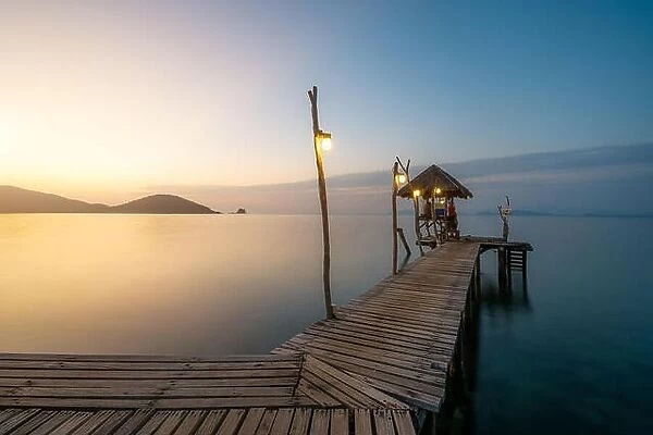 Wooden bar in sea and hut with clear sunrise sky in Koh Mak at Trat, Thailand. Summer, Travel, Vacation and Holiday. Relax and traveling at sea concep
