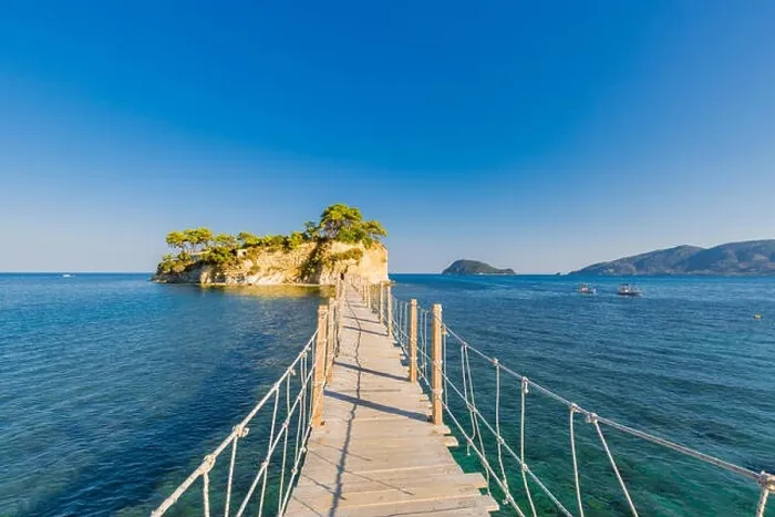 Framed Print : Wooden bridge from Agios Sostis leading to small rocky island. Bay of Laganas, Zakynthos island, Greece Framed Print : Wooden bridge from Agios Sostis leading to small rocky island. Bay of Laganas, Zakynthos island, Greece