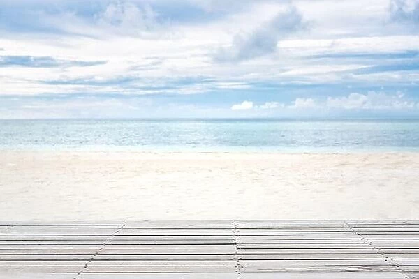Wooden floor over white sandy beach landscape, cloudy sky. Tranquil tropical pattern